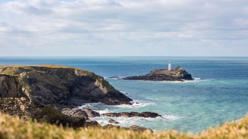 A view of Godrevy lighthouse from the cliffs. The sea is looking a little rough but it is blue